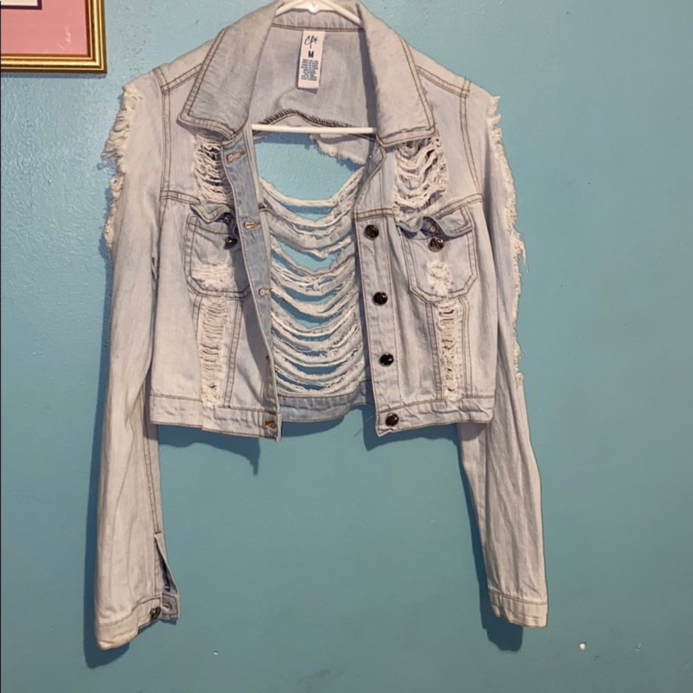 Extremely ripped jean jacket
